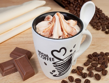 A ceramic mug filled with the real, classic, delicious smooth coffee ice cream combined with thick chocolate sauce. 