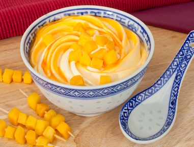 Mouth watering Mango dairy ice cream combined with mango fruit sauce topped with pieces of Mango.

