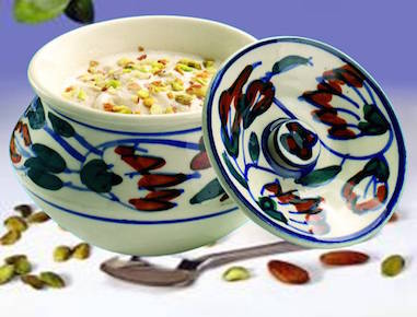 A creation with a special blend to produce the finest Kulfi using unique Saffron sauce, served in a ceramic bowl and decorated with Pistachios and Almonds. 

